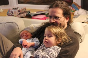 Lochlann and Emma watching TV with Daddy